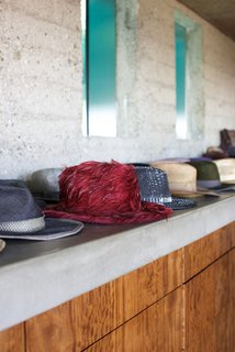 Iconic Perspectives: John Lautner’s Sheats-Goldstein Residence - Photo 7 of 8 - As an aficionado of fashion—along with architecture and basketball—Goldstein visits all of the biggest fashion shows and design houses around the world. He installed an automatic rotating closet that houses his illustrious men's fashion collection. He also proudly showcases his favorite pieces along the concrete shelving in the bedroom.