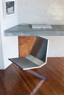 Iconic Perspectives: John Lautner’s Sheats-Goldstein Residence - Photo 6 of 8 - Throughout the house, we were shown a number of Lautner-designed details. Working with Goldstein, the architect was given the opportunity to design custom furniture pieces, which is something he didn’t normally get the chance to do. His angular, minimalist style was carried throughout—as shown here on a custom swivel desk chair that rotates directly from the floor of the bedroom.