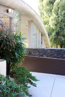 Iconic Perspectives: John Lautner’s Garcia House - Photo 4 of 8 - One of the most iconic elements of the home is the lava rock that was brought over from Hawaii. It still stands as one of the main structural elements.
