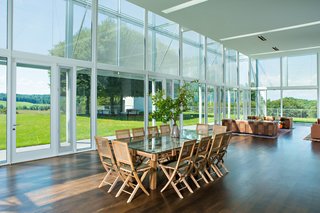 A Thomas Phifer-Designed Glass-and-Steel Masterpiece For Sale - Photo 5 of 14 - The main pavilion consists of a large light-filled area that includes a living and dining room. It boasts 360-degree views, thanks to floor-to-ceiling glass.