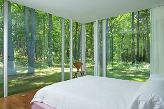 A Thomas Phifer-Designed Glass-and-Steel Masterpiece For Sale - Photo 9 of 14 - The master bedroom in the guest house is clean and simple, shown here with a Cherner Side Chair posted up in the corner.