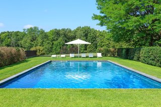 A Thomas Phifer-Designed Glass-and-Steel Masterpiece For Sale - Photo 12 of 14 - By following a pathway of Linden trees from the indoor pool, you’ll find yourself at the outdoor pool. 