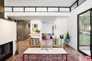 A Glimpse Into a Remodeled Midcentury Abode in Austin - Photo 3 of 4 - The open layout is connected to private gardens with floor-to-ceiling glass. 