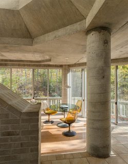 The One-of-a-Kind Home of the Late Architect John Black Lee Drops to $750K - Photo 8 of 10 - Pillars and other raw construction elements are exposed throughout the space. 