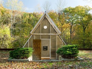 The One-of-a-Kind Home of the Late Architect John Black Lee Drops to $750K - Photo 1 of 10 - Architect John Lee Black built this 1,980-square-foot residence in 1990 and lived in it for 25 years until he passed away in April 2016. Built into the side of the hill, it’s topped off with an A-frame entrance. 