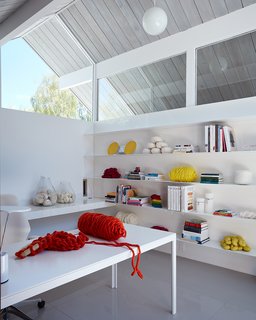 Similar to certain Eichlers, the office looks through the courtyard and into the living room. Klopf Architecture made minor necessary adjustments to the windows but preserved the bulk of the clerestory areas. 