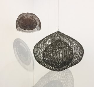 Follow Us Through San Francisco’s FOG Design & Art Fair - Photo 4 of 10 - Based in New York, David Zwirner presented a hanging sculpture by Ruth Asawa (1926-2013), the internationally respected sculptor who first learned how to draw in a Japanese-American internment camp during World War II. Hailing from the 1980s, Untitled S.724 is a single-lobed hanging piece with four layers of continuous form within a form. Though it’s made of oxidized copper wire, it gives the impression of being soft and moldable. 