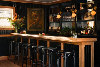 Modern Equestrians Will Find Themselves at Home at This New Americana Hotel - Photo 6 of 7 - The lobby, which doubles as a lounge, is designed to feel like a cozy, classic parlor. The oak millwork is custom and features brass and Carrara marble details. 