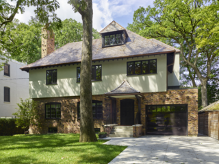 From Front to Back, This Toronto Home Literally Merges Heritage and Modernism - Photo 3 of 3 - They were able to install a new integrated garage into the front while still preserving the historic facade's character. 