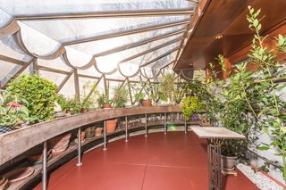 Frank Lloyd Wright’s Last Major Residential Masterpiece Could Be Yours for $8 Million - Photo 9 of 11 - The greenhouse features windows that are finished with a scalloped metal treatment. Gricar points out that the metal scalloping can also be found on the Guggenheim—solidifying a connection to the other project that was on Wright's mind at the time.