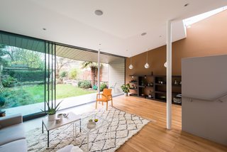 A Fusion of Old and New Makes this Home For Sale Shine on London’s Womersley Road - Photo 6 of 8 - A deck leads out to a southwest-facing garden with a shed that’s hidden by a yew hedge. The hanging pendants are bone china Cibola Pendant Lights by Scabetti. 