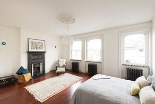 A Fusion of Old and New Makes this Home For Sale Shine on London’s Womersley Road - Photo 7 of 8 - Among the five bedrooms is a master suite in the eaves that has an en-suite bathroom, freestanding bath, and a dressing area complete with under-eaves storage.