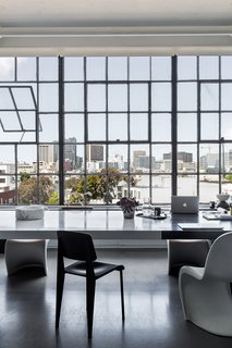 A San Francisco Design Collective Reveals its Impeccably Cool Creative Studio - Photo 3 of 12 - Hollis’ team opened the space by removing multiple walls and preserving the original steel windows and high ceilings. The views stretch from the Bay Bridge to Twin Peaks.