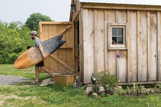 As a photographer with an obsession with the sea, Nick LaVecchia recently finished building his new eco-friendly home in York, Maine. He spent two years researching the technical side and benefits of passive solar design. He’s shown here carrying his 5’10" fish board that he made himself. He learned directly from his brother Mike, who started Grain Surfboards in 2005.
