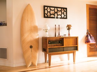 Russell Brownley (a director and DP of surf films) and Brianna Brownley (a footwear designer for Reef) call Carlsbad, California home, where they live with their newborn daughter, Magnolia. When looking for the right home base, they searched for a place that was unique and full of character, and immediately fell in love with this house that has an open-beamed ceiling.