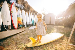 Grant Ellis has been a photo editor at Surfer Magazine for 13 years and lives in a quaint beach shack in Cardiff, California with his wife Julie, son Ethan, and daughter Kaia (shown here).