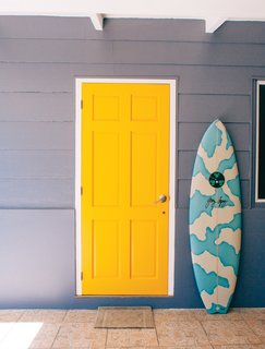 Known as the "unofficial ambassador of Tahiti," Raimana Van Bastolaer lives in a beach house right on the water in Papara on the south side of Tahiti. The bright details found throughout his home perfectly represent the personality that everyone in the surf industry calls up when they're looking for a good time in Tahiti.