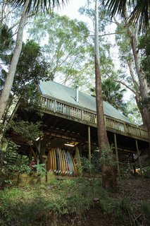 Damion Fuller and Fern Levack live with their son Jake in an A-framed tree house that’s nestled in a forested grove directly next to Royal National Park—just an hour outside of Sydney. This view gives a peek at just one of his quivers from his incredibly extensive surfboard collection.