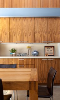 A Year of Careful Study Leads to a Thoughtful Renovation of a 1949 Eichler - Photo 6 of 10 - Throughout the interior, they installed walnut cabinetry and vertical boards made of clear western cedar with a simple oil finish. 