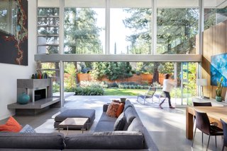 A Year of Careful Study Leads to a Thoughtful Renovation of a 1949 Eichler - Photo 4 of 10 - The new great room opens up completely to the patio with multi-panel pocket sliding glass doors that are 22 feet long. 