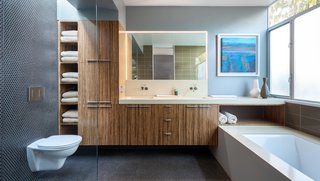 A Year of Careful Study Leads to a Thoughtful Renovation of a 1949 Eichler - Photo 9 of 10 - In the master bathroom, they installed bamboo cabinetry from Plyboo, a San Francisco-based company that thrashes and presses bamboo into dense logs that are then sliced and fabricated into the surface of your choice. 