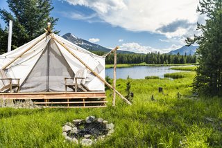 The team behind Collective Retreats built the custom canvas tents with wood that they sourced locally. They used timber they found in the property’s vicinity to hold the peaks together at the top. Shown here is the Yellowstone location. 