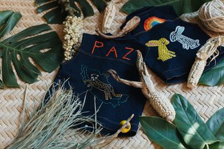 Part II of Our Exploration of Mexico City’s Caravana Americana - Photo 9 of 18 - They produce little denim vests for kids that are handmade with a traditional embroidery process in Zinacantán in Chiapas, México.