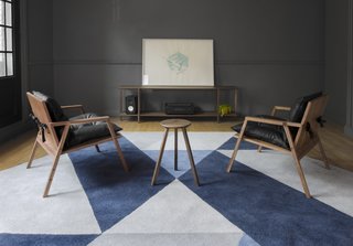Part II of Our Exploration of Mexico City’s Caravana Americana - Photo 15 of 18 - A pair of Finger Chairs by Cuchara are shown here in front of one of their consoles. It’s created with walnut and black vinipiel for durability. 