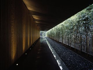 Architect Spotlight: 12 Works by Japanese Architect Kengo Kuma - Photo 10 of 12 - Surrounded by a garden and featuring a bamboo lined approach, the Nezu Museum's unique roof design blends the interior space with the garden. 