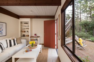 The Midcentury Home That Daniel Liebermann Built For His Parents Asks $2.8 Million - Photo 12 of 16 - Shown here is the addition that was built by Jay's father to fit the rest of their large family. He made sure to keep the design, look, and materials as consistent with Liebermann’s main design as possible. They ended up painting the walls white in order to bring more light into the space.
