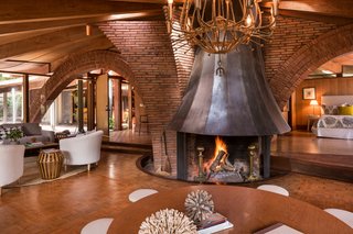 The Midcentury Home That Daniel Liebermann Built For His Parents Asks $2.8 Million - Photo 4 of 16 - Liebermann had the steel fireplace fabricated off-site, which acts as the center of the house. Jay Little told us that he worked with many local businesses to get the work done on the house, some of which are still in business. 