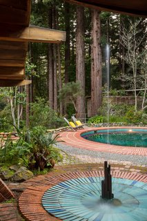 The Midcentury Home That Daniel Liebermann Built For His Parents Asks $2.8 Million - Photo 13 of 16 - Both the pool and fountain feature original blue vertical tiles from Heath Ceramics, both of which are still functional. 
