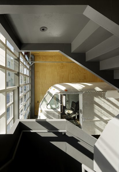 The roll-up aluminum-and-glass garage doors at each end of the building allow the client to pull art pieces or retro vehicles into the 20-foot-deep, Turf Block–paved backyard.
#interior #interiorarchitecture #sanfrancisco #workshop #interstice #intersticearchitects #cesarrubio #cesarrubiophotography
Photo 9 of Minna Street DREAM:shop modern home