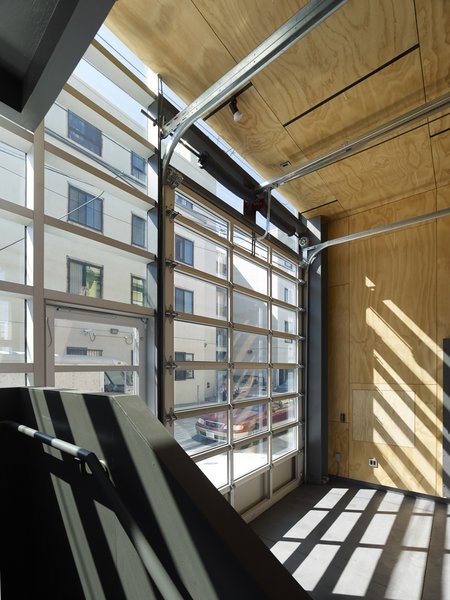 At each end of the tube, expansive glass presents the new interior as an ever evolving deep “stage” directly onto the street – a “mise-en-scene” of the workshops numerous fabrication projects, revolving exhibits, and energetic educational programs.
#interior #interiorarchitecture #sanfrancisco #workshop #interstice #intersticearchitects #cesarrubio #cesarrubiophotography Photo 6 of Minna Street DREAM:shop modern home