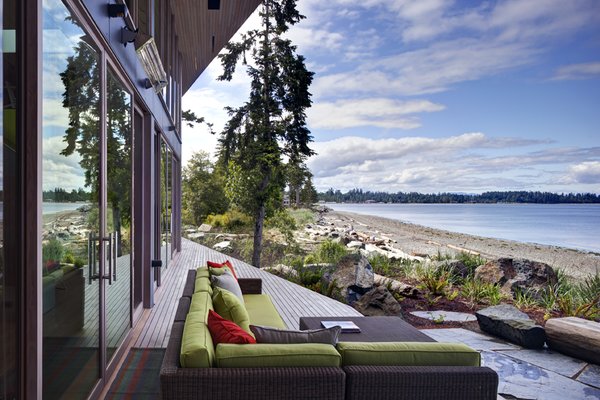 The main house is clad in the local Douglas fir with deep protective eaves, stained grey to match the sun-bleached drift wood logs that litter the coast.
#facade #residential #residentialarchitecture #coastline #beachhouse #beachhouses #view #porch #beachfront #britishcolumbia #vancouverislands #bradlaughton #bradlaughtonphotography Photo 9 of TreeHugger modern home