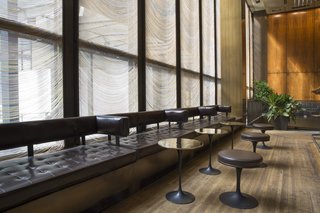 Wright Auctions Off Items from the Seagram Building's Four Seasons - Photo 4 of 4 - Custom side tables and stools by Eero Saarinen lined the bar, adjacent to the Grill Room.