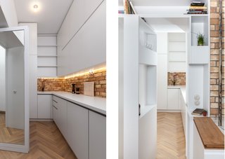 A Hidden Passageway Makes Each Room in This Berlin Flat a Private Destination - Photo 4 of 6 - Concealed doors make the service area double as a private passageway. A mirror-lined door connects to the master suite (left); at the other end, a pivoting shelf door (right) leads to the kitchen and dining area. For the resident, an entrepreneur of a cold brew coffee business, the service area is also his home workspace.