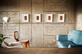 With a View of the Andes, This Concrete Retreat in Ecuador Follows the Sun - Photo 2 of 5 - Sparse but colorful furnishings soften up the interior, contrasting with the raw, hand-poured concrete surfaces throughout.