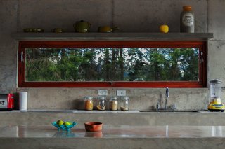 With a View of the Andes, This Concrete Retreat in Ecuador Follows the Sun - Photo 3 of 5 - Poured by hand on site, nearly the entire structure of the El Quinche House—including the kitchen counters and sinks—was made of concrete sourced from a local quarry.