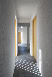 A Minimalist Retreat at the Edge of South Africa's Karoo Desert - Photo 5 of 6 - By day, the home's rectilinear windows cast an artful composition of linear shadow and light.