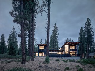 A Family's California Ski Retreat is Designed to Blend in With Its Site - Photo 5 of 5 - The structure is divided into two solid vertical volumes connected by glazed living areas. The cedar cladding and steel panels reflect the hues of the surrounding forest. 