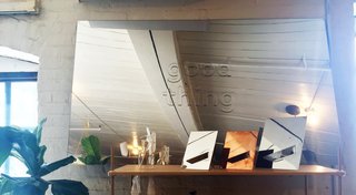 Inside the Designer's Studio: Good Thing - Photo 4 of 5 - A trio of the brand's Easy mirrors and a group of Gather vases sit on a shelf in front of a large logo-branded mirror. 
