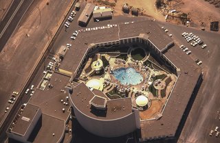The Architecture of Excess: Caesars Palace at 50 - Photo 6 of 7 - An ariel view of Caesars Palace and the Gardens of the Gods pool oasis, circa 1970.