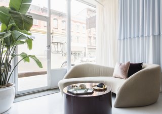 This Brooklyn Boutique Is an Oasis of Calm in the Busy City - Photo 1 of 6 - A sinuous Preview sofa by Vladimir Kagan for Weiman greets visitors to Brooklyn jewelry boutique Quiet Storms.