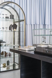 This Brooklyn Boutique Is an Oasis of Calm in the Busy City - Photo 4 of 6 - A vintage 1970s mirrored case by the Design Institute of America displays select treasures on the back wall of the shop. 