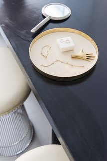 This Brooklyn Boutique Is an Oasis of Calm in the Busy City - Photo 3 of 6 - A Carl Auböck Hand paperweight joins a selection of pieces including Jemma Wynne's Revival Snake Chain bracelet.