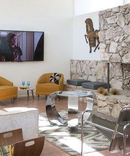 This Palm Springs Hotel is Filled with Vintage Midcentury Modern Finds - Photo 1 of 5 - The hotel is filled with a mix of vintage pieces from different eras, many sourced from the Perez Design District in Cathedral City and Etsy. The Antiques Gallery of Palm Springs in Sunny Dunes was a favorite source for "smalls," the quirky midcentury accessories like resin grapes or gravel art that can be found throughout the hotel. <span style="line-height: 1.8;">"Buying this type of furniture, you can't agonize over it," Kathy says. "If you think about it too long and wait, it may be gone."</span>