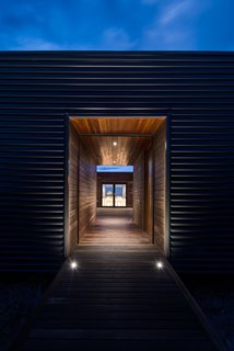 The house was designed to be lightweight for easier transport. The timber frame includes LVL components, and steel was used only where needed for subfloor columns and window lintels.