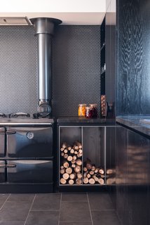 The kitchen features a <span style="line-height: 1.8;">Donard wood-fired stove by Stanley</span><span style="line-height: 1.8;"> and tiles from Classic Ceramics. </span>