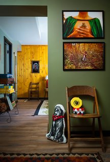 This Wisconsin Hotel Suite Conjures the Best of Summer Camp—Hold the Bug Spray - Photo 3 of 9 - Art and games throughout the space invoke camp memories. Much of the art and accessories, like the photographs above, come from the Camp Wandawega Land of Nod collaboration. 